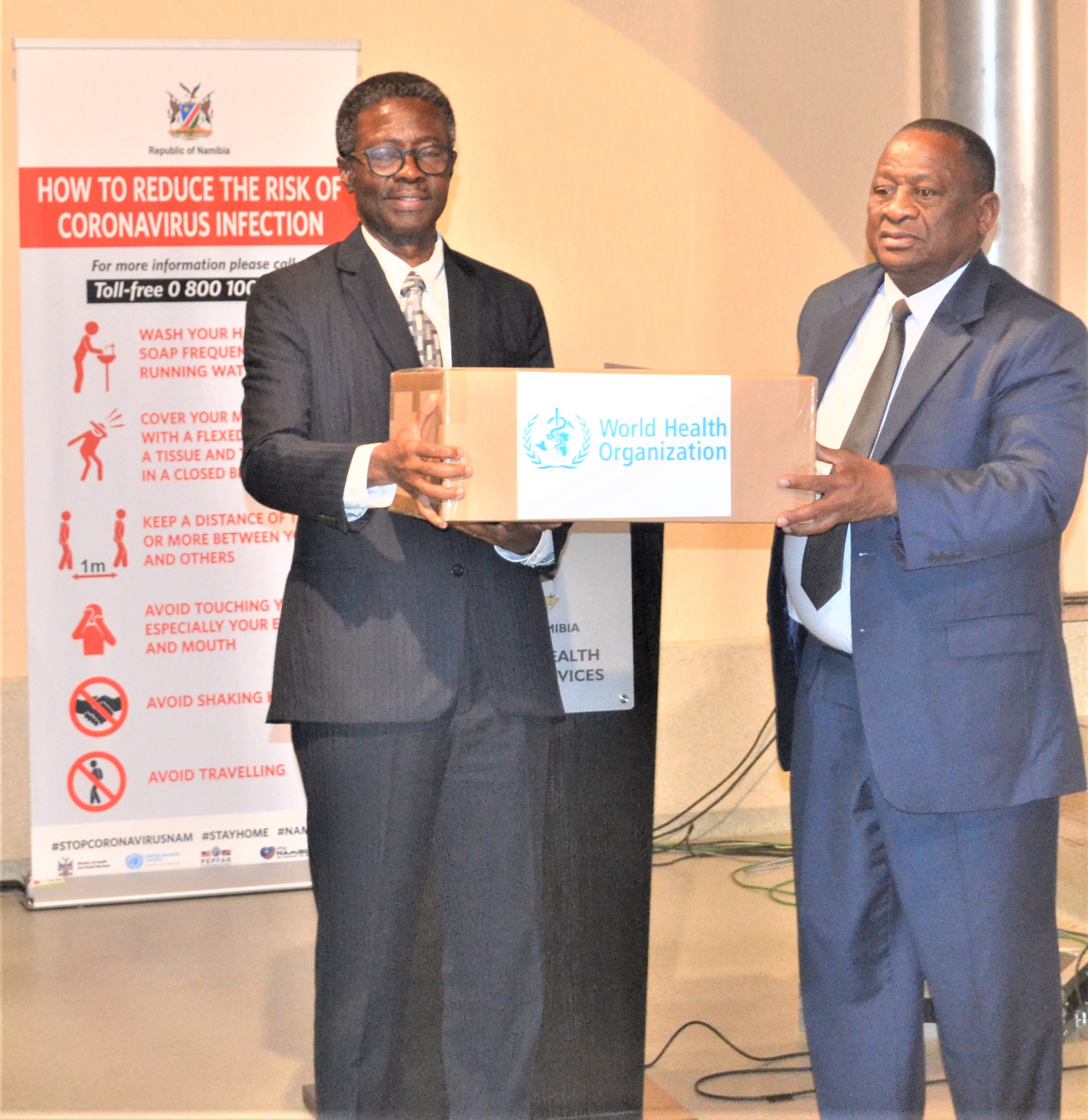WHO Representative, Dr Charles Sagoe-Moses handing over COVID-19 medical supplies to the Honorable Minister of Health and Social Services, Dr. Kalumbi Shangula 