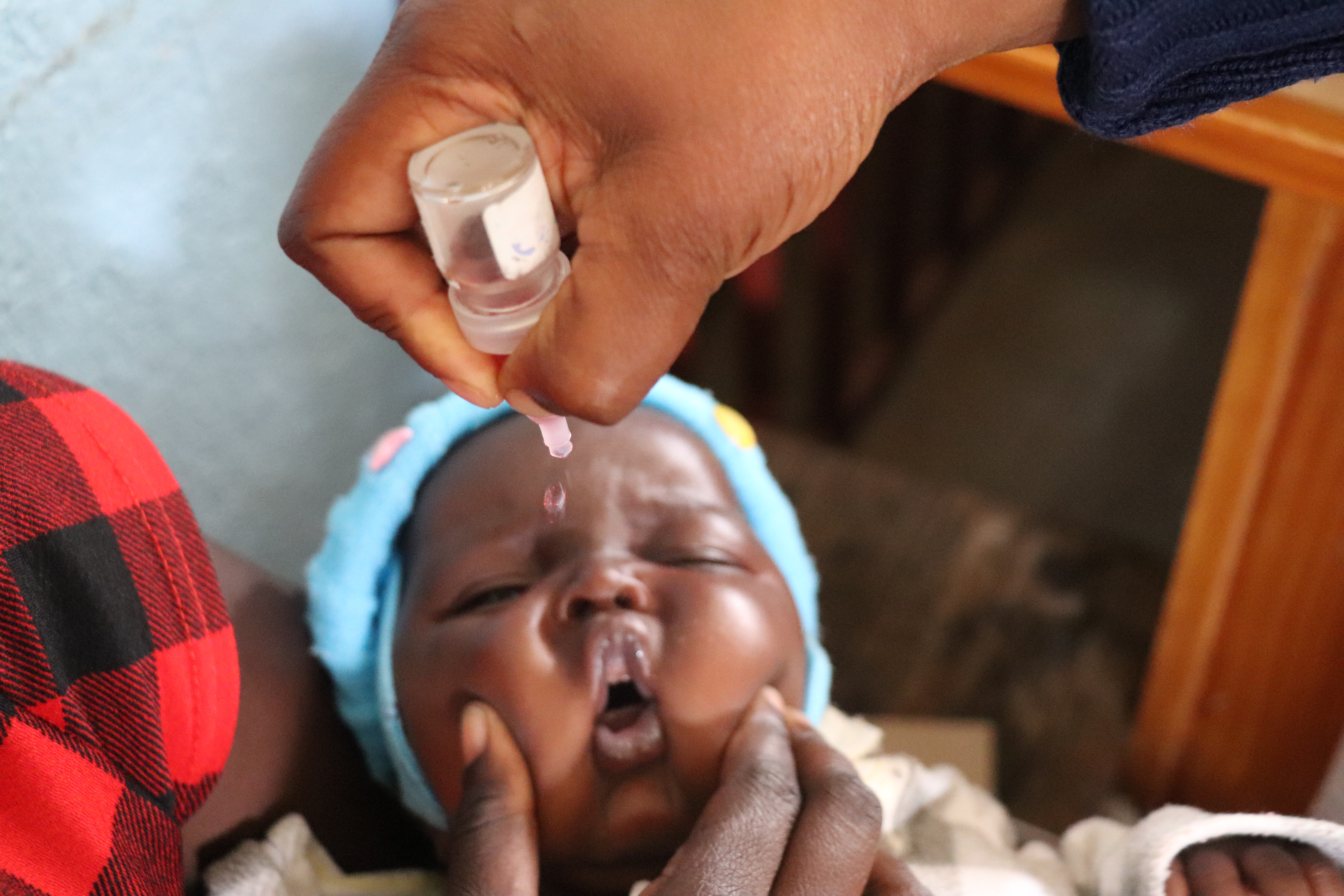 Lilosa Muti’s 6-week-old baby, Joshua, getting vaccinated at Bikita Rural Hospital, Zimbabwe. 2020  ©WHO/Tatenda Chimbwanda