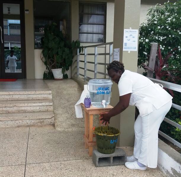 A Professional Nurse at the JFK  Medical Center demonstrating proper hand hygiene during the WHHD in Monrovia 