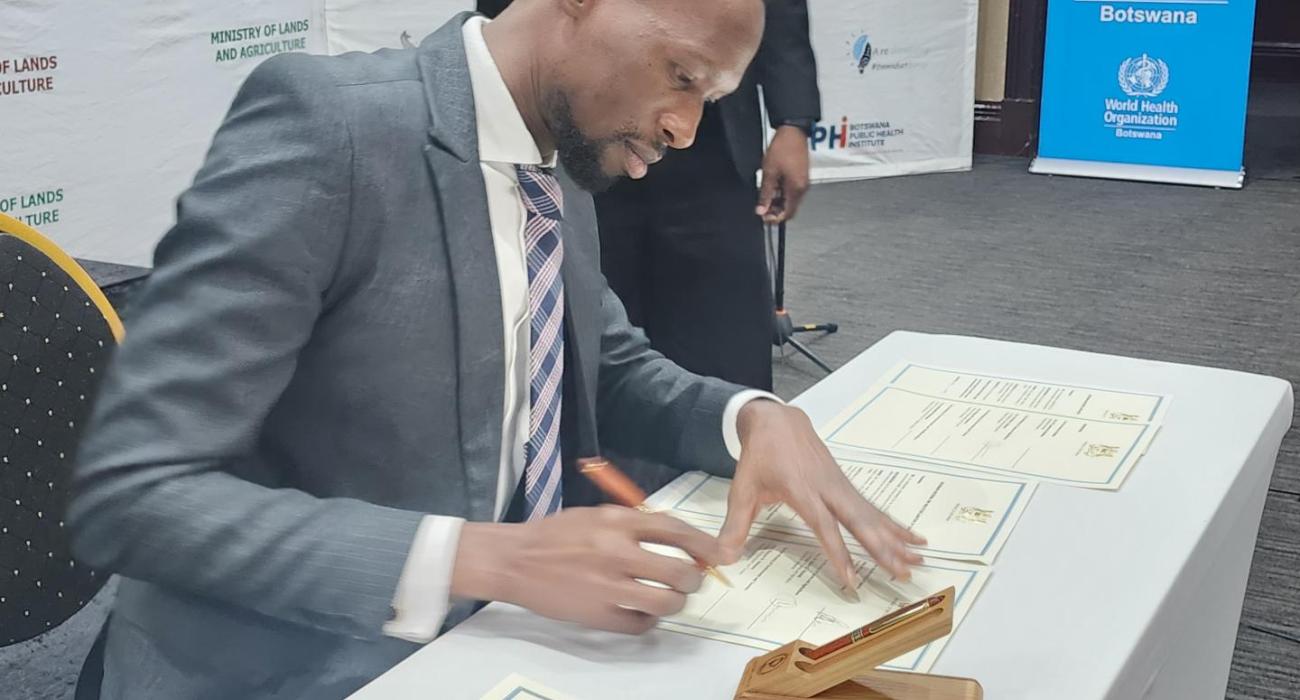 Acting Minister of Health, Mr Lawrence Ookeditse Honorable Acting Minister of Health, Mr Lawrence Ookeditse, signing the commitment for the implementation of the One Health National Strategy