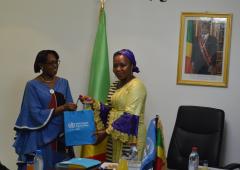 Dr Moeti handing a gift to the Ministry of Health of Congo