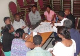 Participants engage in group work during the ENGAGE-TB sensitization workshop.