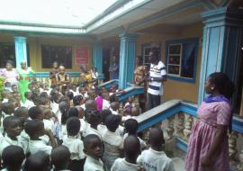 WHO LGA Facilitator  in sensitization meeting with teachers and pupils in a Yenagoa Primary school
