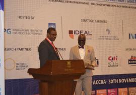 Dr Kaluwa presenting the award to  Dr Anyah