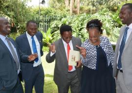  An elated Director of Medical Services Dr Jackson Kioko (centre) and team respond to the news ' Kenya meets the GW Certification criteria' and closer to GW-free status. From left: Drs. John Ogange (WHO), Dr Peter Cherutich (MOH), Dr Joyce Onsongo (DPC, WHO) and Dr Sam Mahugu (MOH)