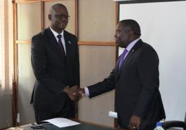 The WHO Representative, Dr. Nathan Nsubuga Bakyaita (left) shaking hands with the Minister of Forein Affairs Hon. Harry Kalaba after presenting letters of credence.