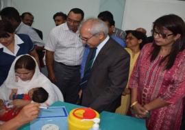 The first Mauritian baby receiving the Hexavalent vaccine in the presence of Dr A. Husnoo, Health Minister, Mrs R. Jadoo-Jaunbocus, Minister of Gender Equality, Child Development and Family Welfare and other eminent staff of the Ministry of Health and Quality of Life