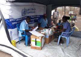 Patients recieve medicine at the camp