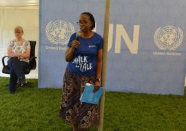 WHO Representative Dr Josephine Namboze motivating participants, with UNRC J Barrins seating in the background