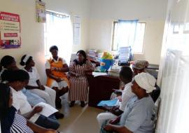 A QoC facility QI meeting facilitated by a QI coach at a PHC in the FCT