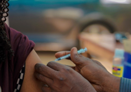 A woman receiving the COVID-19 vaccine in Abuja