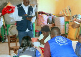 Mother who gave birth to a baby at IDP camp in Mangu interacting with WHO and IOM officials during an assessment of the IDP camp.jpg