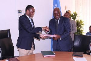 The WHO Representative, Dr. Rufaro Chatora and the Permanent Secretary, Dr. Donan Mmbando exchanging the certificates of transfer.