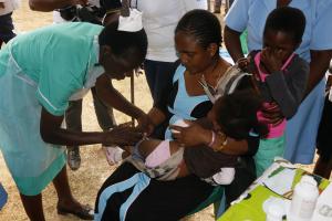  A child being vaccinated against Measles and Rubella during the launch of the Integrated Measles and Rubella Supplementary Immunization Activities campaign at Kasungu community ground