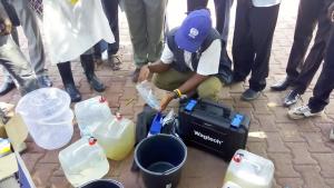 Mr Alex demonstrating water quality testing and treatment for National Public Health officers in Juba