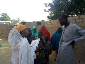 Community Health Champion educating household members on the common household diseases and preventive measures. Photo  WHO NOA, Borno state.