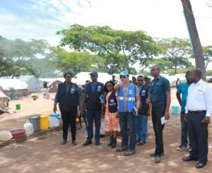 The WHO Representative, Dr. Nathan Bakyaita  (second from left), accompanied by WHO National Surveillance Officers and the Disease Prevention and Control Officer on a conducted tour of Mantampala Refugee Camp