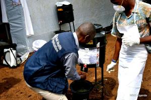 WHO official demonstrates proper hand-washing at Kasango Cholera treatment center in Kyangwali refugee camp 