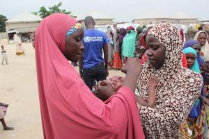 Health Worker administering Oral Cholera Vaccine to people in the Maiduguri Metropolitan Council, Maiduguri.