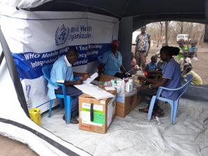 Patients recieve medicine at the camp