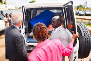 Dr Clement shows the German Ambassador and Minister of Health the equipped ambulance and first ost of spare parts