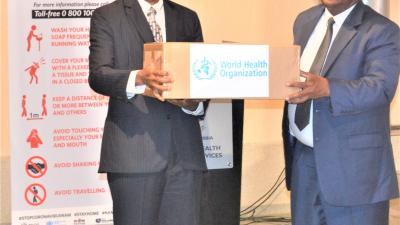 WHO Representative, Dr Charles Sagoe-Moses handing over COVID-19 medical supplies to the Honorable Minister of Health and Social Services, Dr. Kalumbi Shangula 