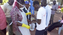Public Health Officers carrying out a return demonstration on water quality testing procedures