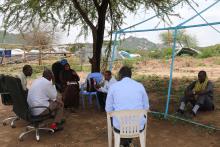 Kifa Bashir (center) in a discussion with the community leaders in Babile Woreda. Photo: WHO/Tseday Zerayacob