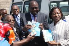 Minister of Health, Dr. Chitalu Chilufya and the Health Advisor from DFID, Uzoamaka Gilpin receiving copies of the WHO CCS from the WHO Representative a.i. Dr. Custodia Mandlhate.