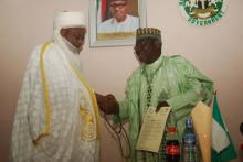 The  Sultan (left) handing the Letter of commendation to His Excellency, Governor Tanko Al-Makura