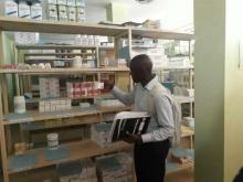 Team Member from MOH inspecting medical supplies at St. Carolus Hospital