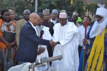 03 WR handing over keys to motorcycles to Kano Governor while Emir of Kano looks on