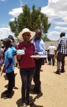 One of the field epidemiologists with water treatment tablets distributed in the affected communities 