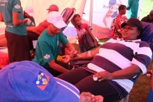A community member donating blood during the commemoration