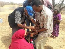Dr  Ahmed Hassan, WHO, vaccinates a child in one of the hard to reach areas in Garissa County