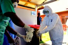 Health workers practice infection prevention and control at the Ebola Treatment Unit