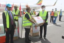 The Chinese Ambassador handing donated materials on behalf of donors to WFP Represntative Madame Wanja Kaaria