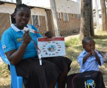 Deborah Marie,a CHV in KIsumu county,  explains the  kit she uses to support malaria detection