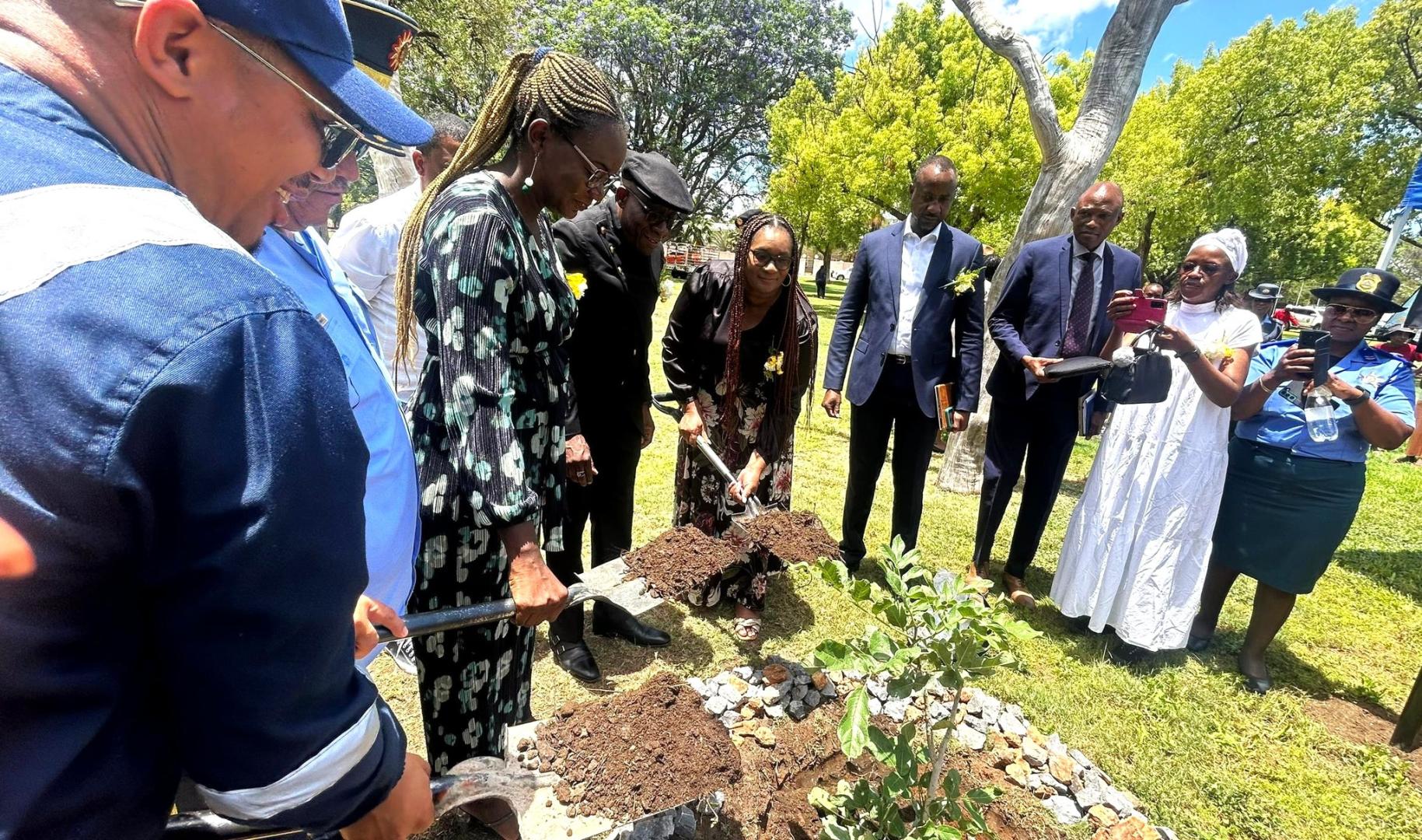 Mrs Kaunatjike of WHO, planting a tree honoring those affected by road traffic crashes on behalf of the WHO Representative 