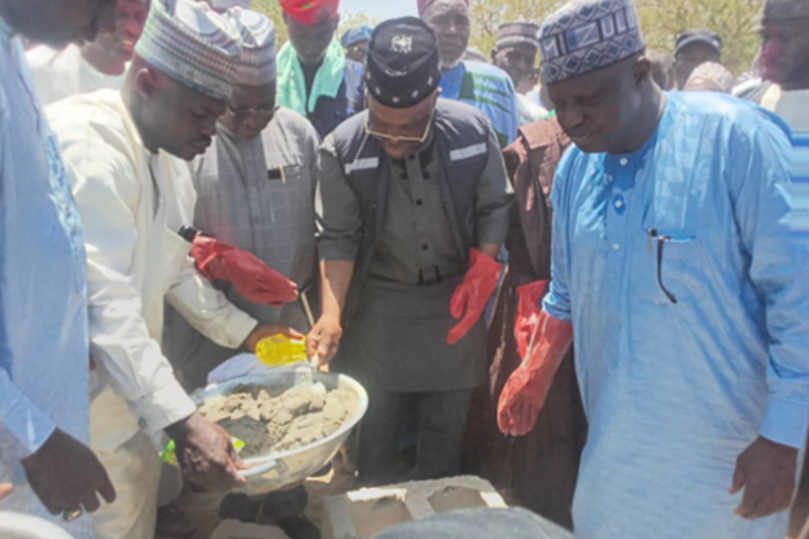 Middle, WR performing the symbolic foundation laying ceremony of the Monguno Specialist Hospital expansion project 