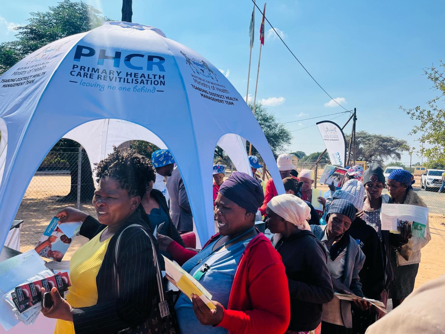 Community members queue for services during African Vaccination Week in Tsabong