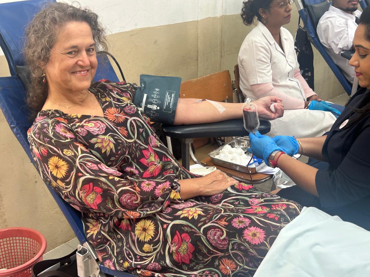 Dr Anne Ancia, the WHO Representative donating blood and calling upon students to commit as lifetime donor