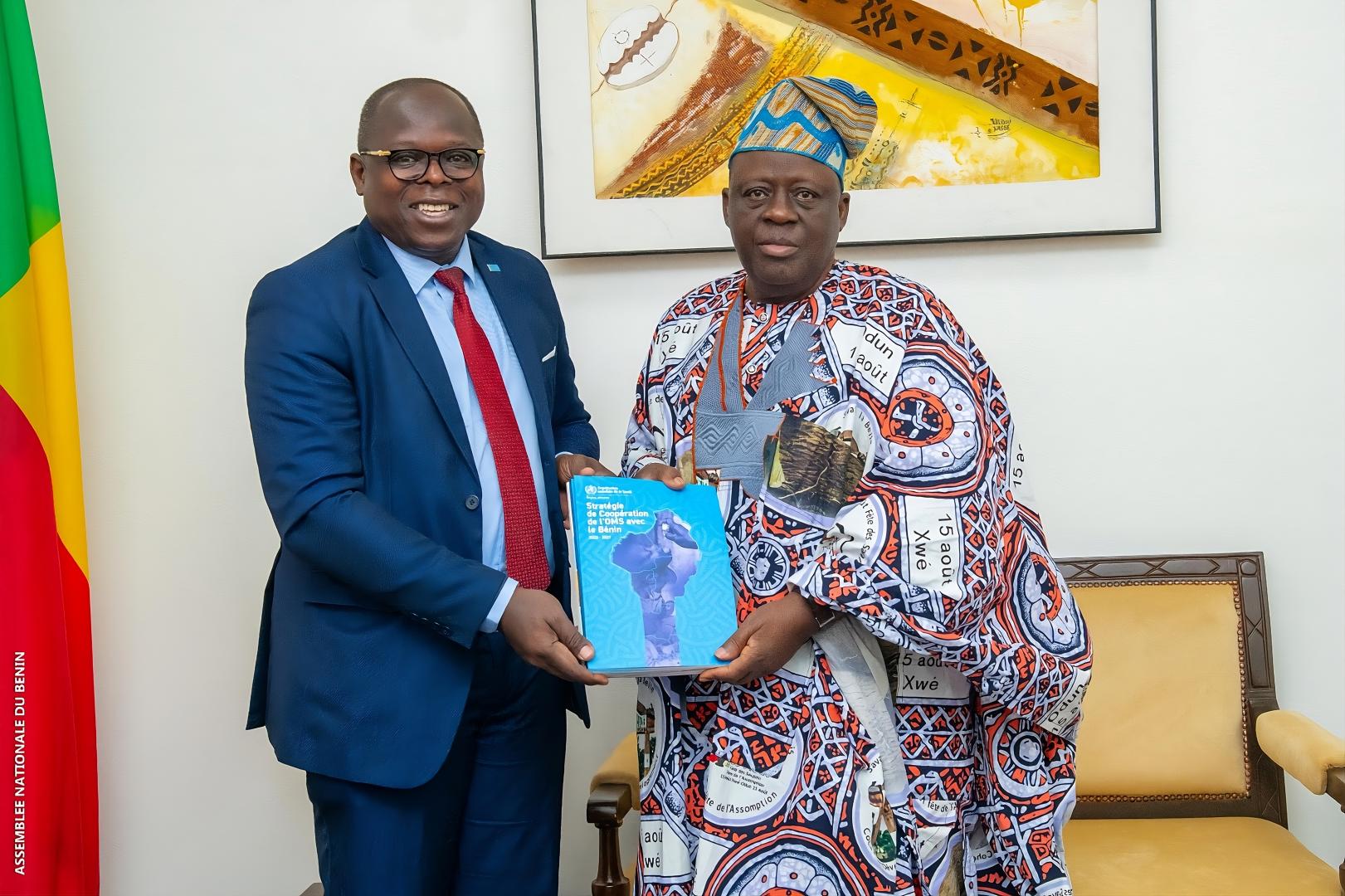 Dr. Kouamé Jean Konan, WHO Representative in Benin, presenting the WHO Benin Country Cooperation Strategy 2023–2027 to His Excellency Louis Gbèhounou Vlavonou, President of the National Assembly.