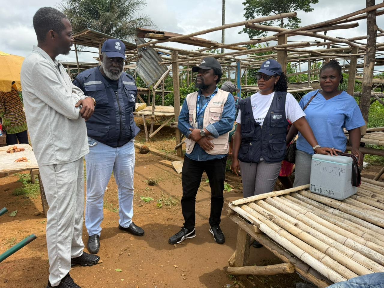 WHO Representative Dr Olushayo Olu visits a yellow fever vaccination site in Grand Cape Mount County.