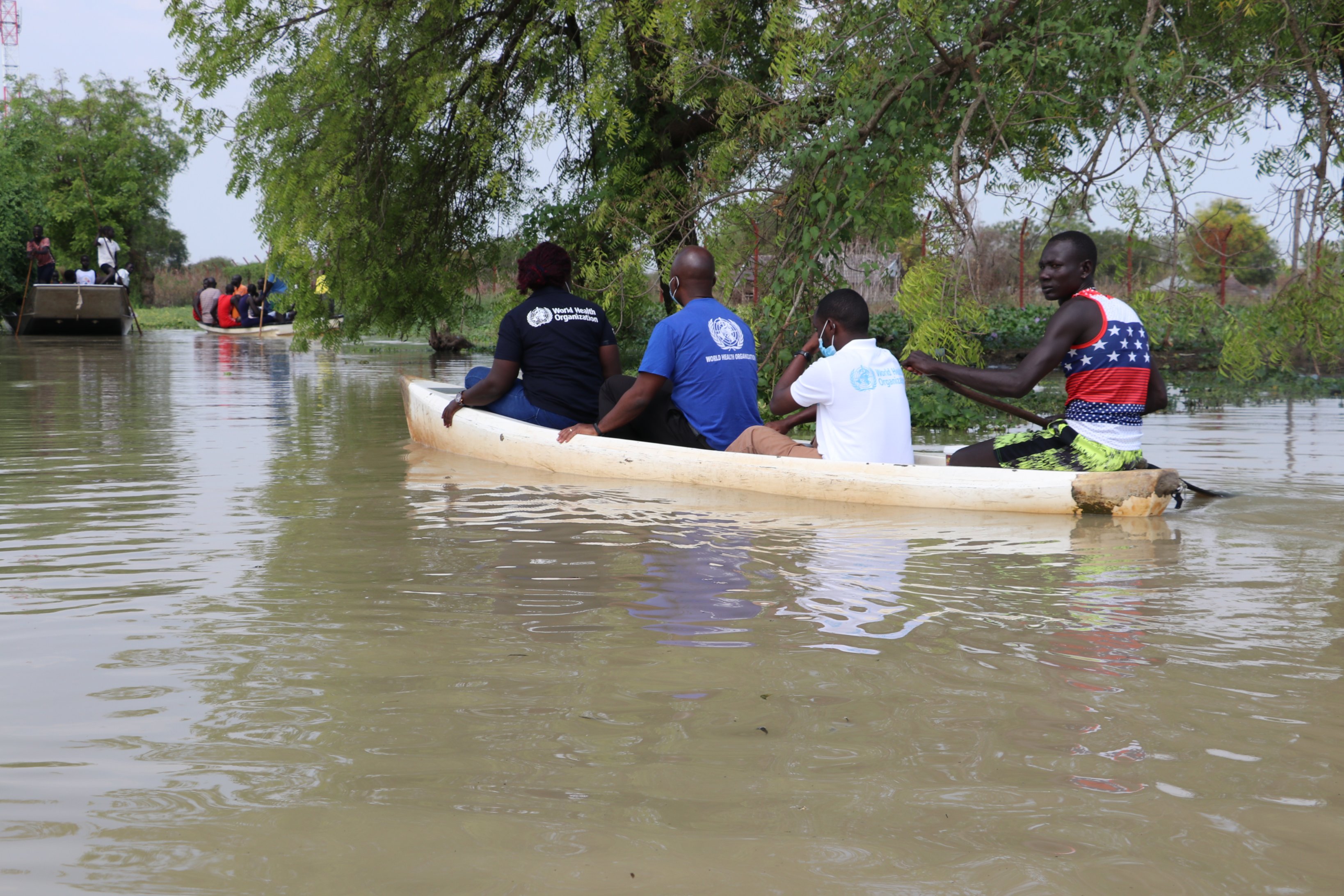 n flooded areas in South Sudan, WHO personnel use canoes to provide much-needed healthcare services.