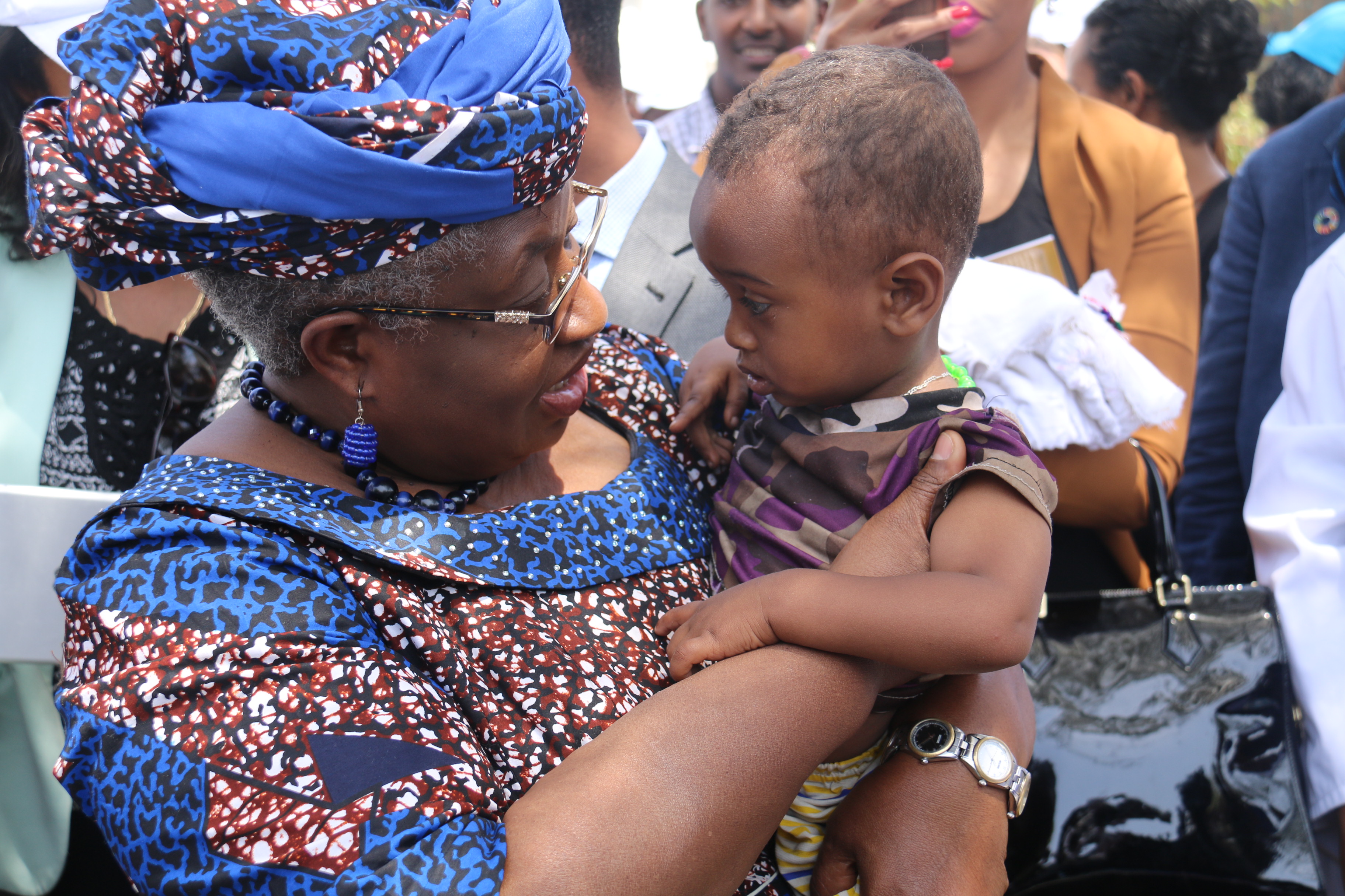 Dr Ngozi Okonjo-Iweala, Gavi Board Chair,with a child vaccinated measles second dose during the launching