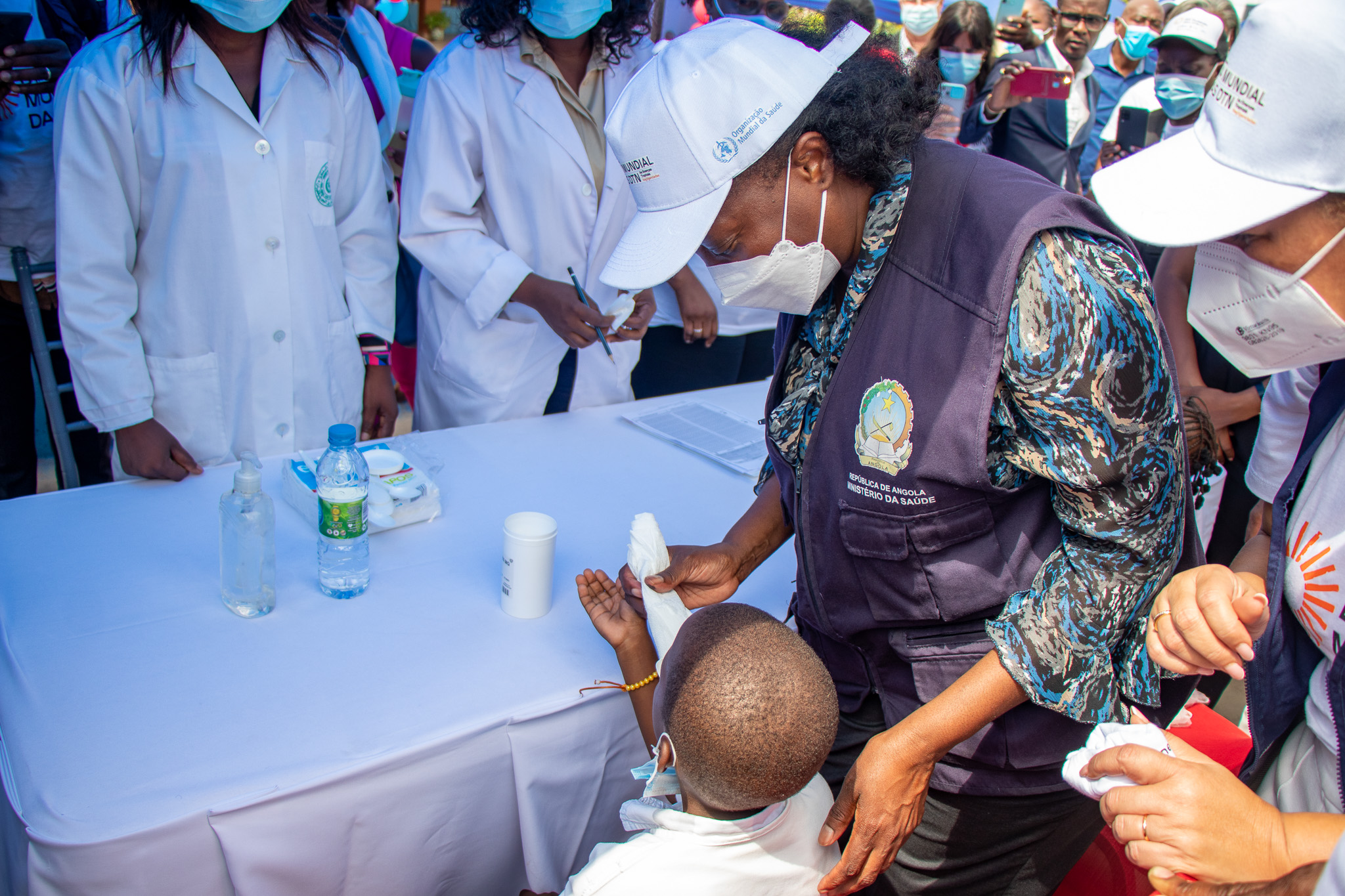 Minister of Health assisting the population