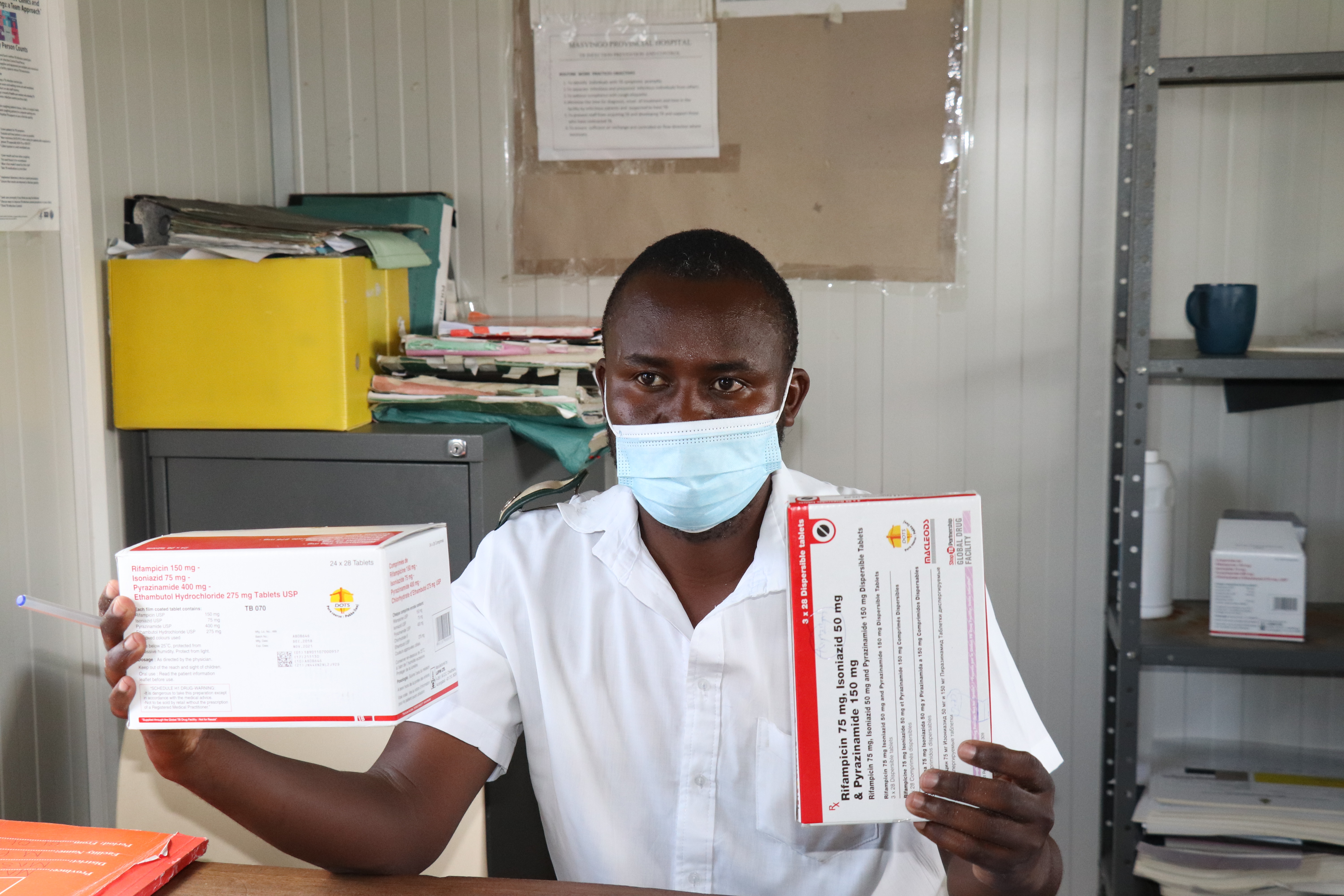 Health Care Worker Holding TB Drugs 