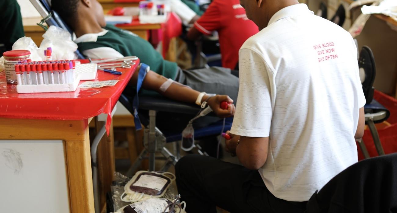 A student donating blood at Nyetane High School 