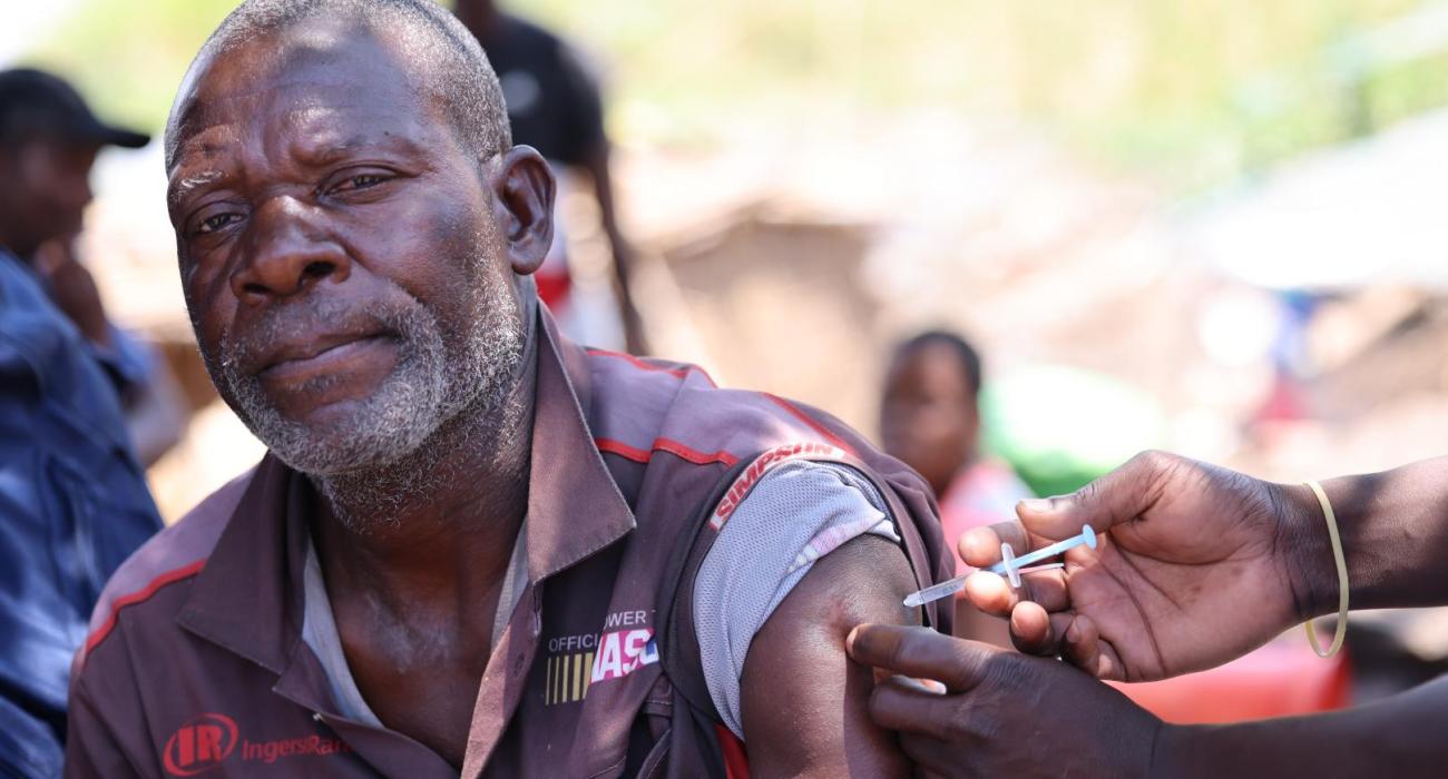 Namita proudly receives his first Covid-19 Vaccine dose